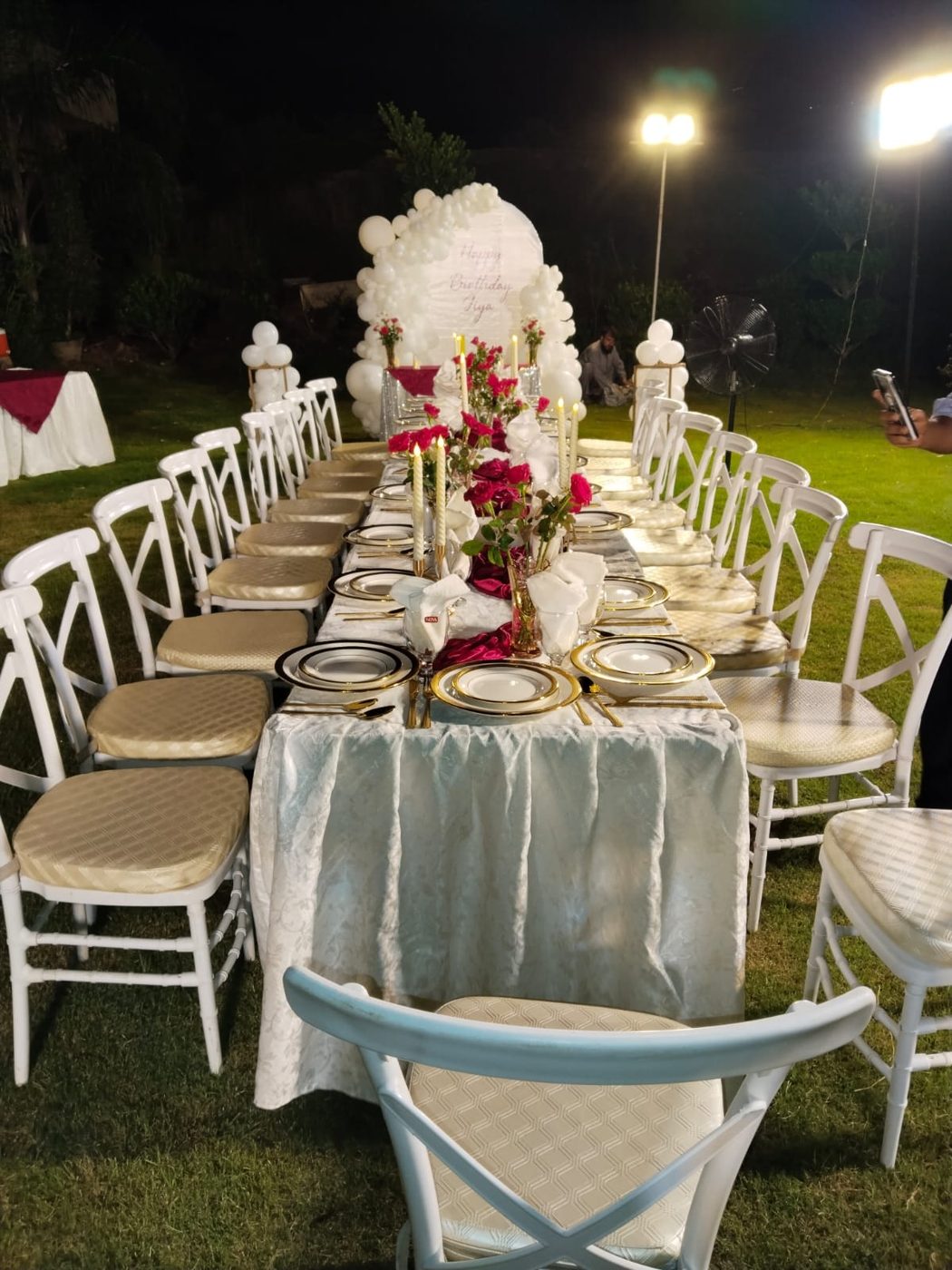 Oasis birthday table styling with candles and florals